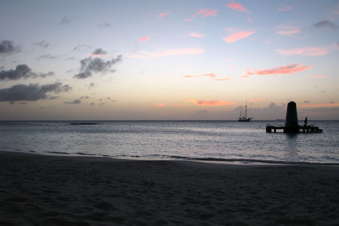 Sunset over the sea on an Aruba beach